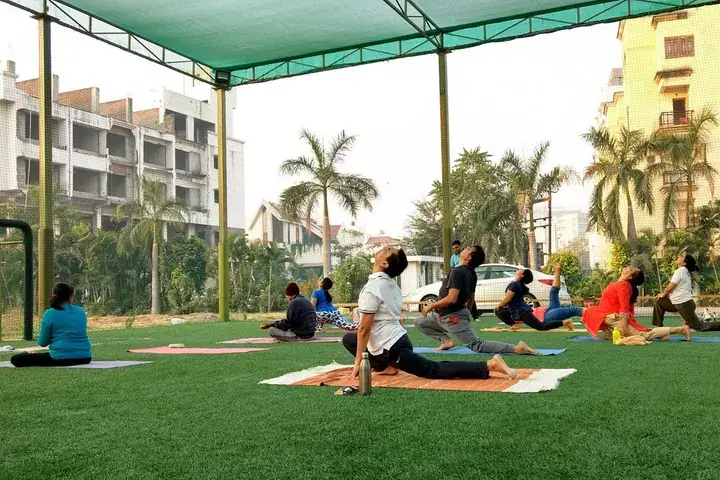 Group yoga session on a Huddle turf