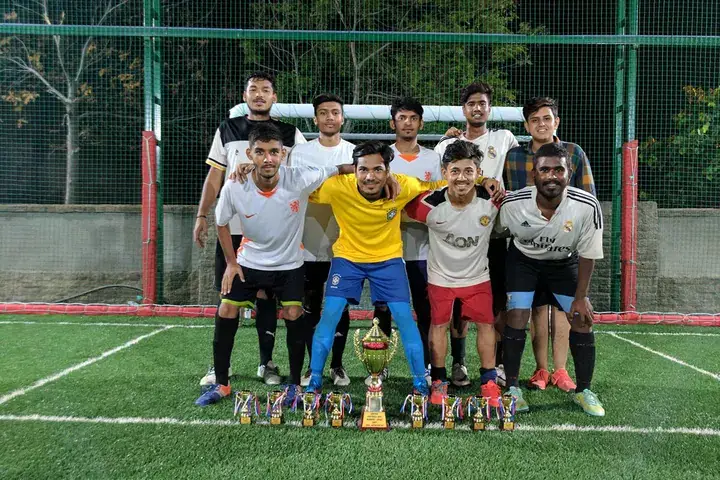Tournament team gathered at a Huddle venue